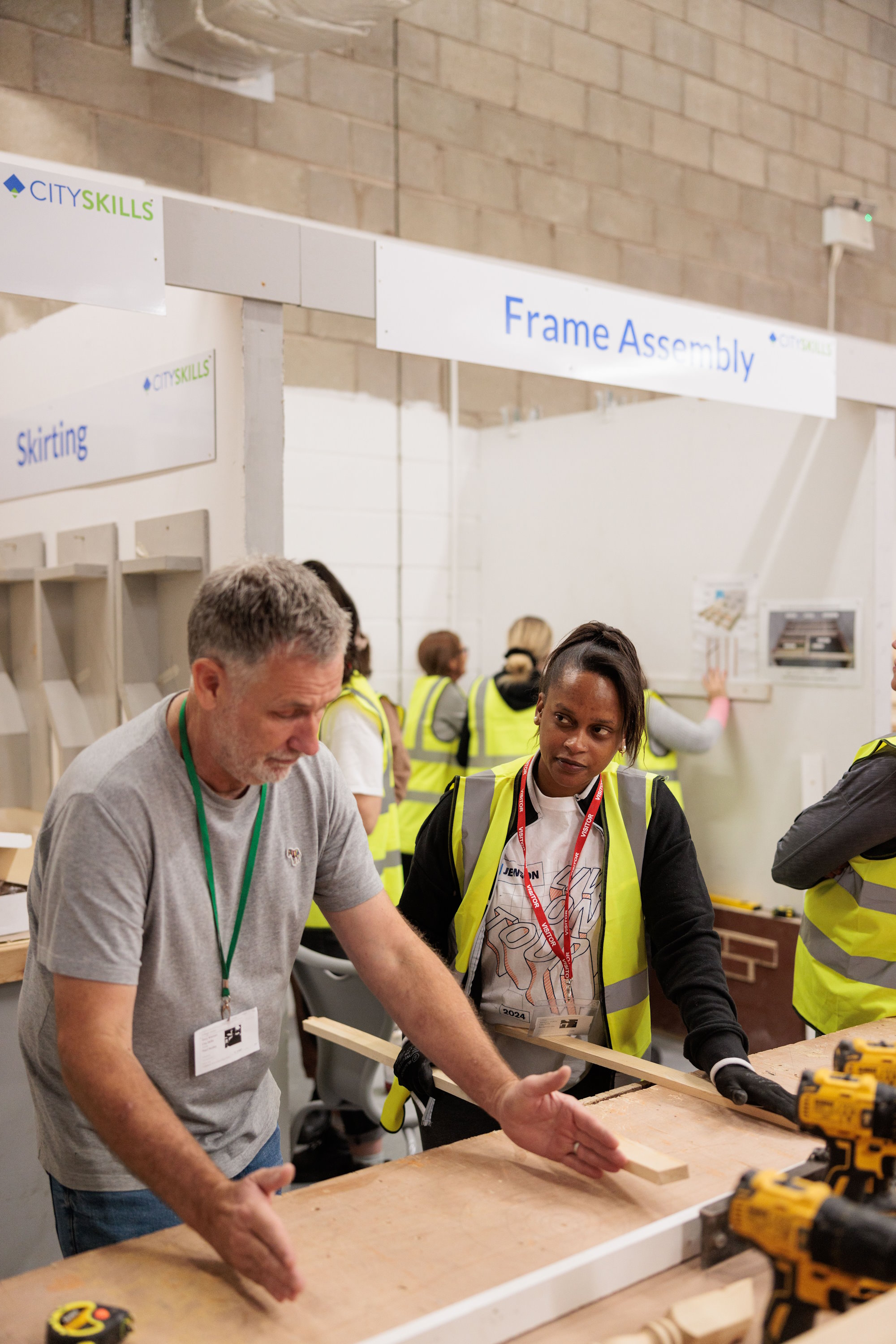 A teacher at City Skills showing a student how to do something