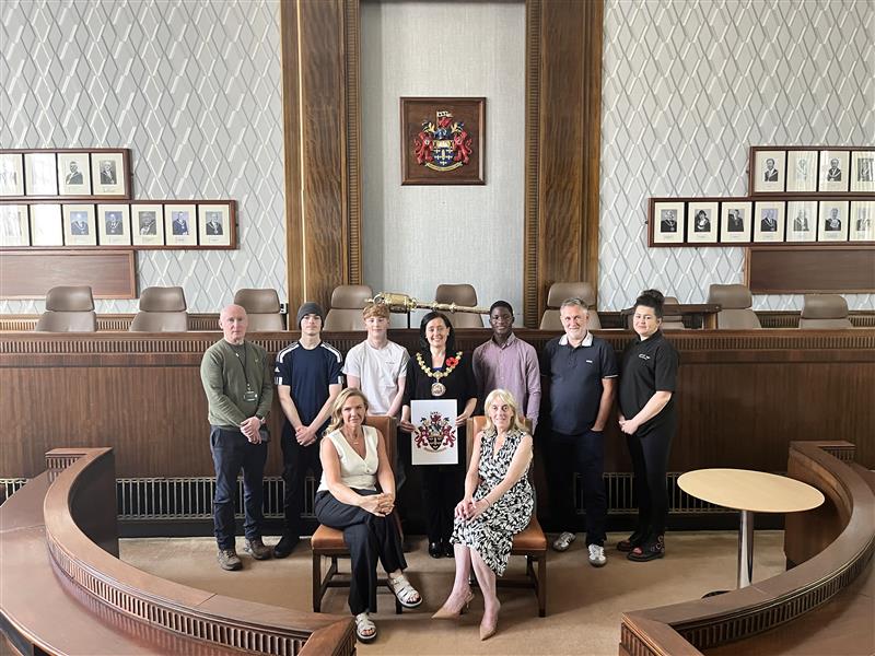 Cllr Burch with Josh, Jerry, Jamie and others in the council chamber