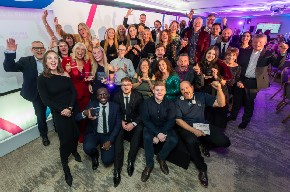 A group of people celebrating together at an awards event