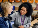 A teacher sat with a young woman